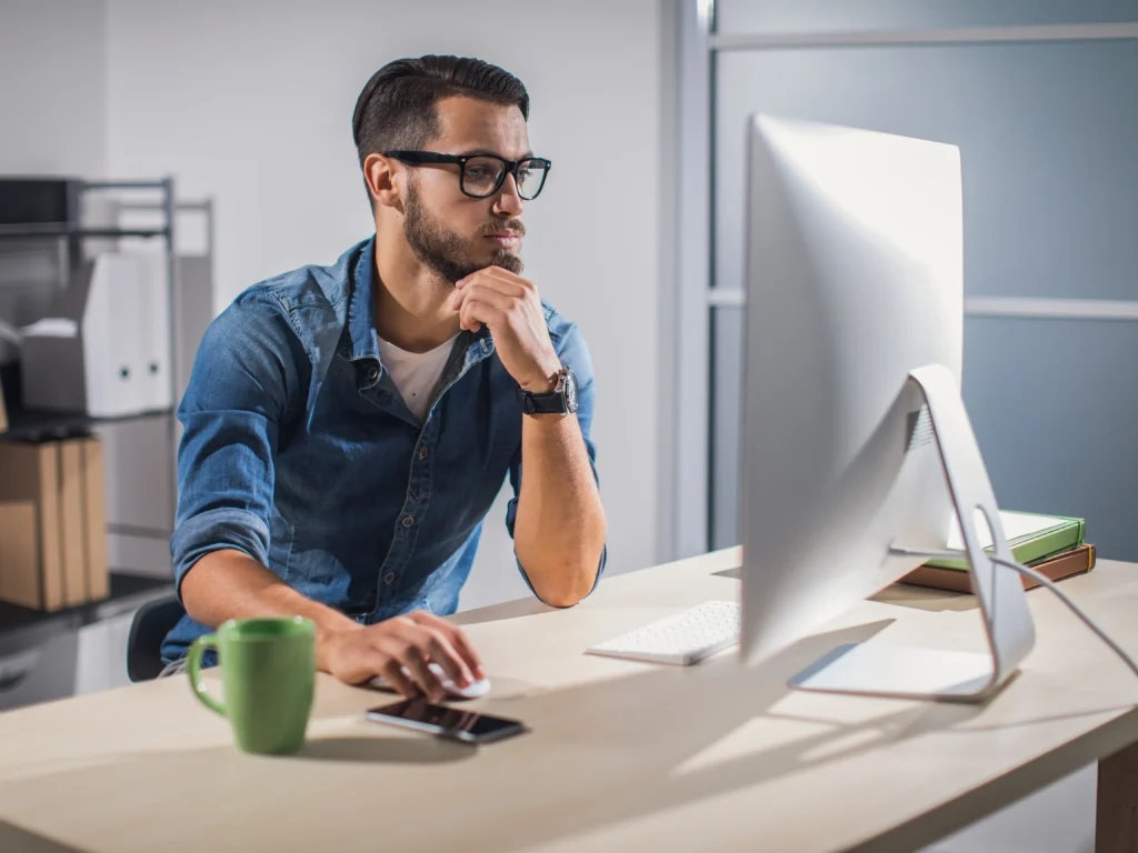 Man working at the computer during the web development process