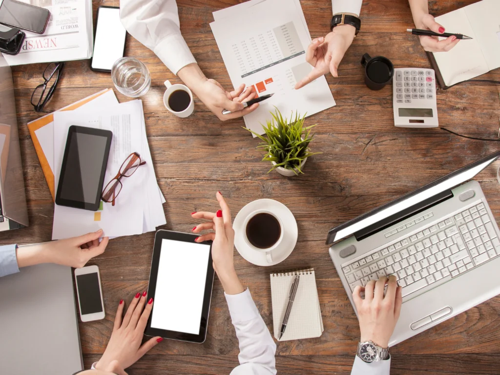 People holding a meeting during the pre-development process during the web development process