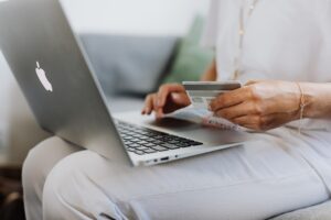 Person checking card making a purchase online
