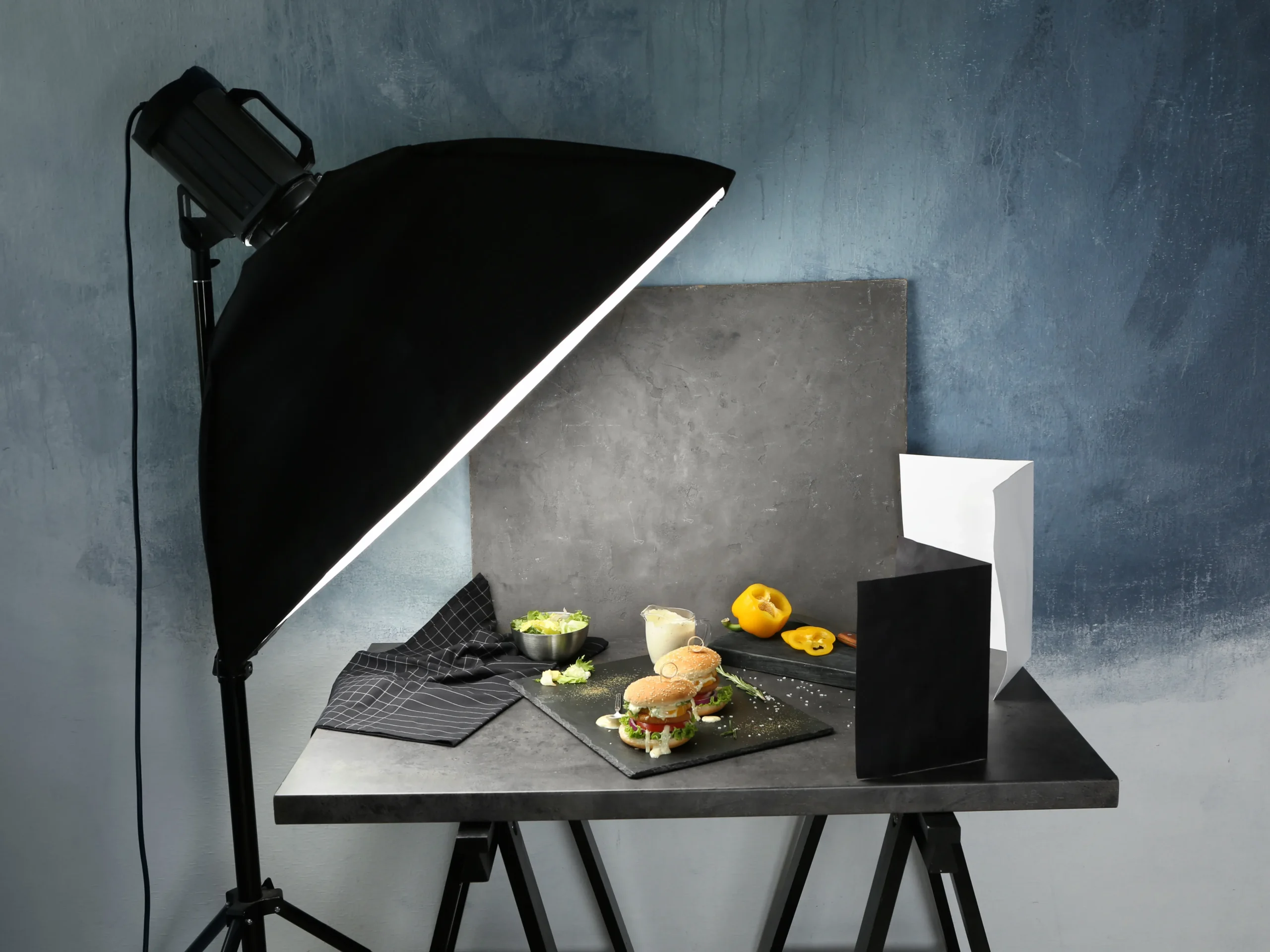 light shining on table of food for photography in marketing