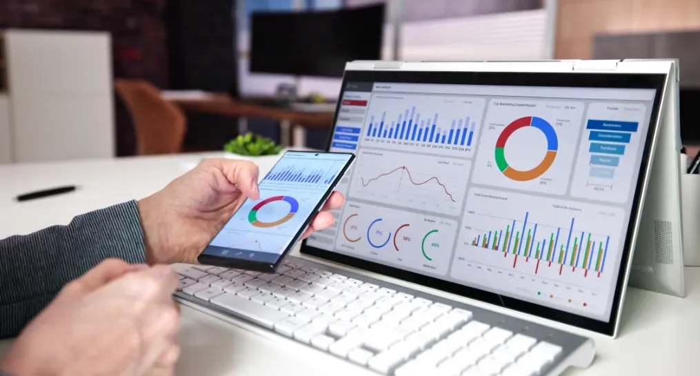 How Corkboard Concepts Crafts a Data-Driven Marketing Strategy 1 person looking at ga4 data on their computer and phone