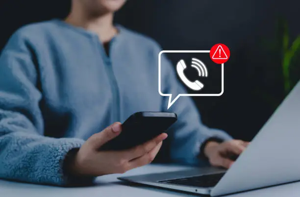 someone on cellphone getting notified with a spam call/message