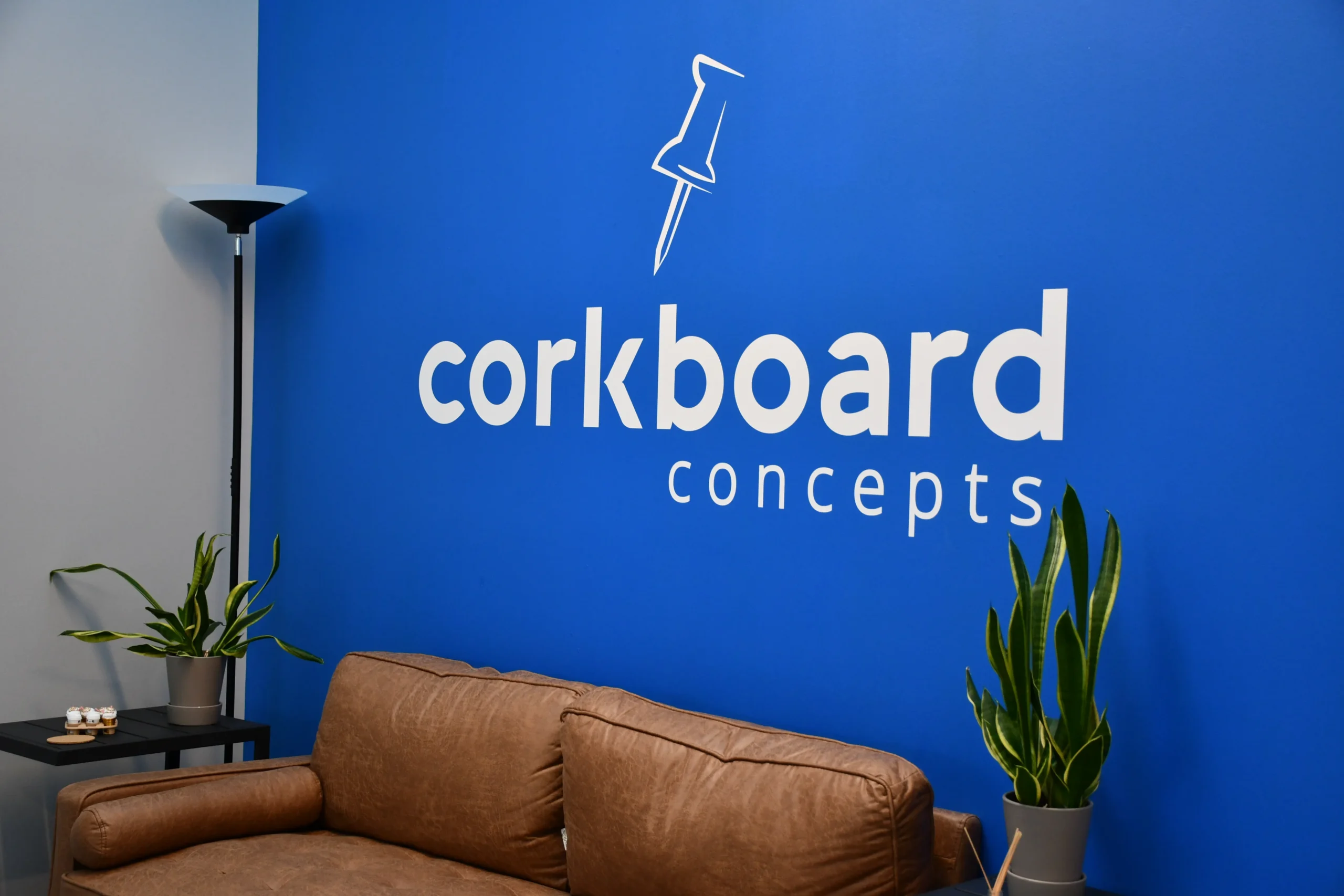 CBC front of office couch and logo
